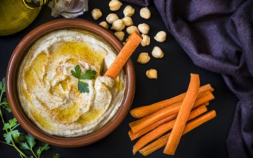 hummus and vegetables spread on a table
